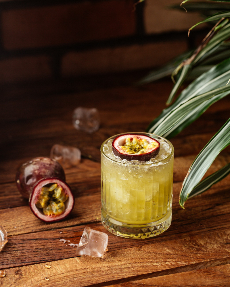 front-view-fruit-cocktail-with-ice-cubes-wooden-desk-fruit-cocktail-drink-juice.jpg